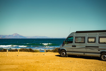Fototapeta na wymiar Camper van on beach, camping on nature