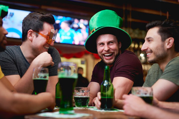 Group of men enjoying time together in the pub