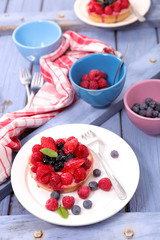fresh berries fruits tart, cake with strawberry, raspberry and blueberry
