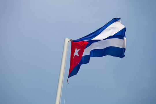 Flag of Cuba waving against blue sky