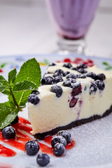 cheesecake with fresh blueberries and mint