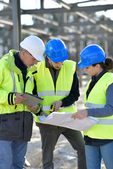 Apprentices with instructor on building site