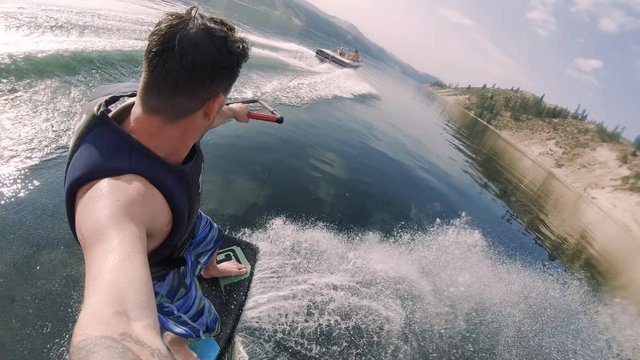 Watersports Self Filming Slash and Spray Wakeboard Behind Motorboat Slow Motion