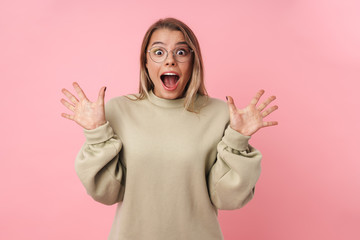 Portrait of young excited woman expressing surprised and looking at camera