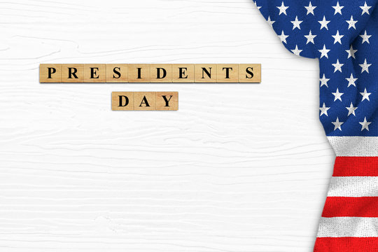 Happy Presidents' Day On White Wood Background With American Flag Border.