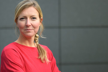 Attractive blond woman smiling at the camera