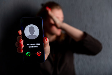 Phone call from unknown number. Scam, fraud or phishing with smartphone concept. Prank caller,...