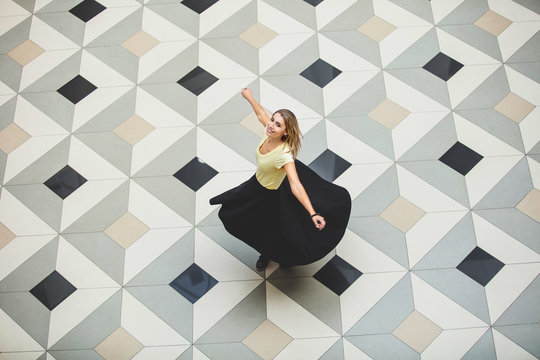 Woman Young Adult Beautiful Happy In A Large Hall With A Floor With Geometric Tiles Top View