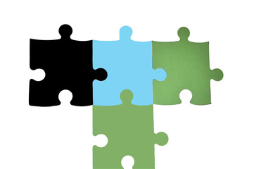 Das Puzzle, viele passende Puzzleteile ergeben ein Ganzes.