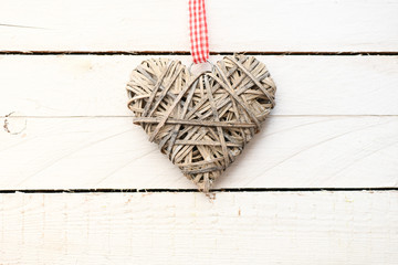 Valentine`s day concept background. Heart on a wooden table.