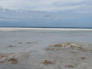 Summer morning at the beach with high tide.