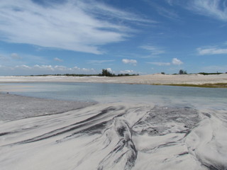 Summer morning at the beach with high tide.