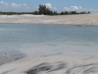 Summer morning at the beach with high tide.