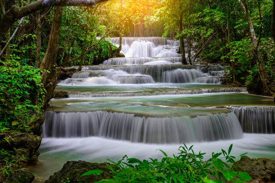 A beautiful waterfall deep in the tropical forest steep mountain adventure in the rainforest. © Stock_ko