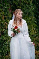 Young beautiful bride in a wedding dress