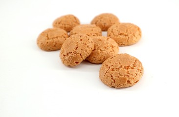 Amaretti, almond based traditional italian biscuits, on white background