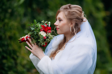 Young beautiful bride in a wedding dress