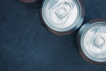 Silver soda metal diet energy drinks cans top view background