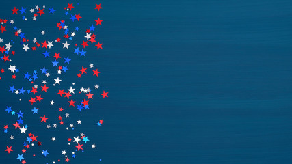 Confetti stars in American flag colors on blue background. USA Independence Day, Presidents Day, American Labor day, Memorial Day, US election concept.