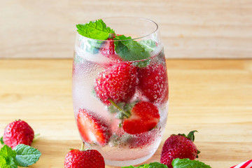 fresh Strawberry mojito cocktail with ice and mint in glass