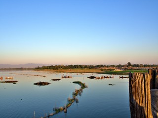 The boat and landscape of lake that show natural beauty at U Bein Bridge in Mandalay, Myanmar