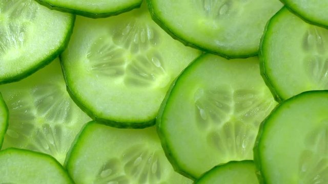 Top view of fresh sliced cucumber rotation