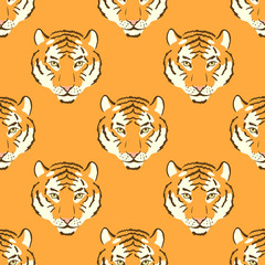 Vector orange seamless pattern with tiger heads.