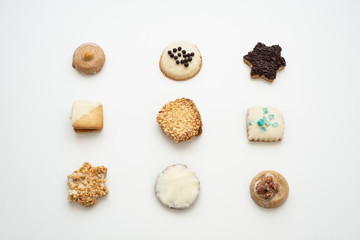 Pattern of decorated biscuits on white background. Top view. Flat lay. 