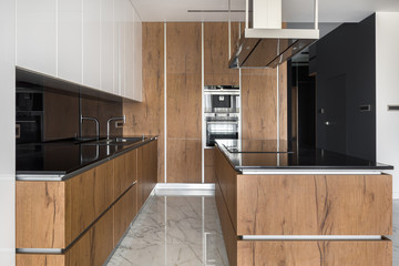 Stylish kitchen with wooden furniture