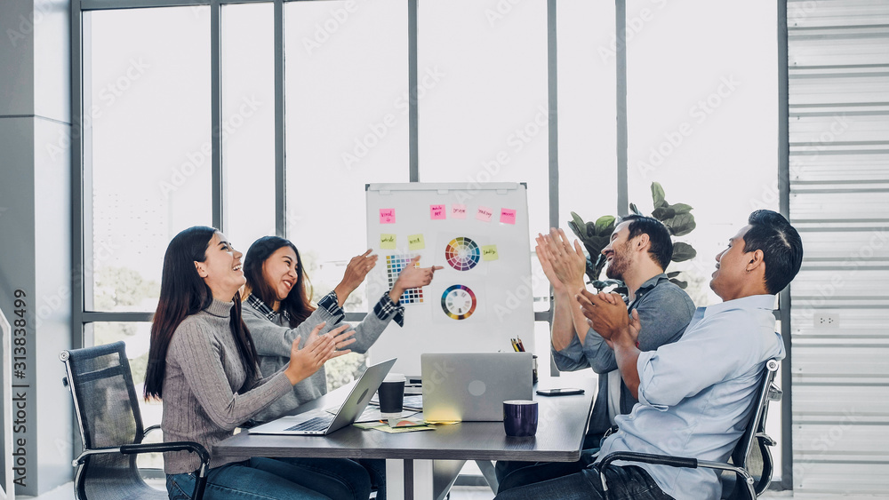 Aufkleber diversity creative designer applaud for job success at meeting table at modern office after finish p
