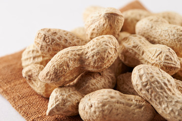 Heap of peanuts on white background