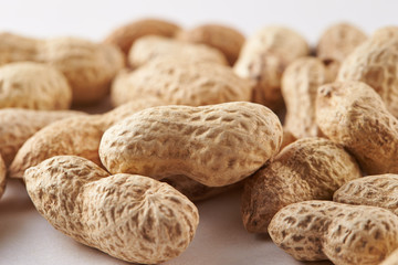 Heap of peanuts on white background
