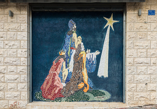 Exterior wall of a house with a mosaic of Johany Sofer depicting a scene from the Bible on the street in Bethlehem in Palestine