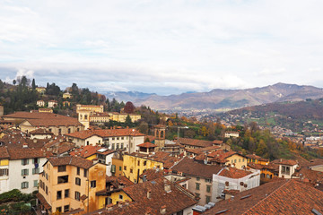 Fototapeta na wymiar Aerial view of Bergamo old town with mountain range behind.