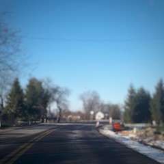 Abstract blurred background with asphalt road in Poland. Transportation bokeh concept background.