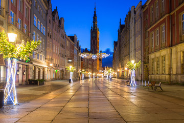 Beautiful architecture of the Long Lane in Gdansk with Christmas ligths at dawn, Poland.
