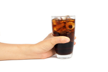 Glass of drink cola with ice in hand on white background