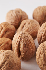 Heap of walnuts on white background