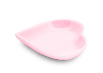 Red plate in shape of heart isolated on white background.