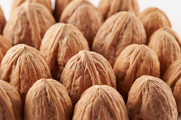 Heap of walnuts on white background
