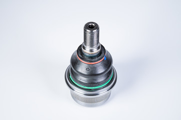 New spare parts spherical ball joints of a suspension bracket of a car on a gray background