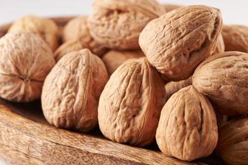 Heap of walnuts on white background