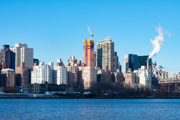 Obraz na płótnie Canvas Midtown Manhattan Skyline along the East River in New York City with the Queensboro Bridge