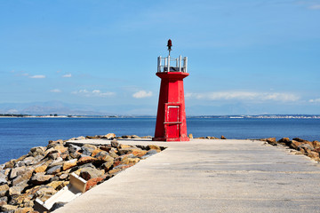 Red lighthouse on the Gola del Segura on the Segura river of Guardamar del Segura, Alicante. Spain. Europe. September 23, 2019