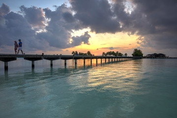 Footbridge of Paradise Island (Lankanfinolhu) at sunset, Maldives