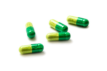 Green pill isolated on white background