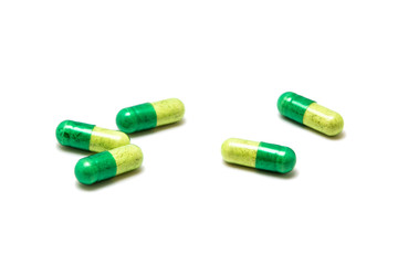 Green pill isolated on white background