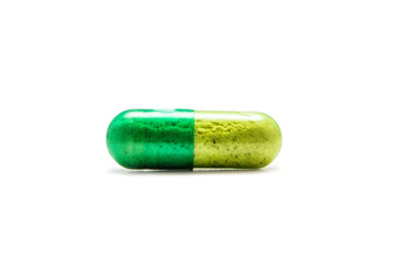Green pill isolated on white background