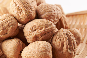 Heap of walnuts on white background