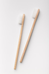 Two bamboo toothbrushes isolated on the white background